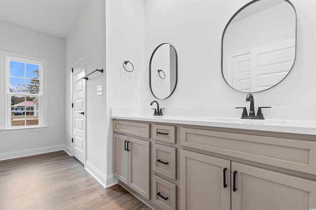 bathroom featuring vanity and hardwood / wood-style floors