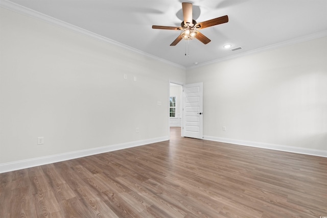 empty room featuring crown molding, ceiling fan, and hardwood / wood-style floors