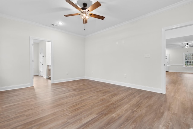 unfurnished room with crown molding, ceiling fan, and light wood-type flooring