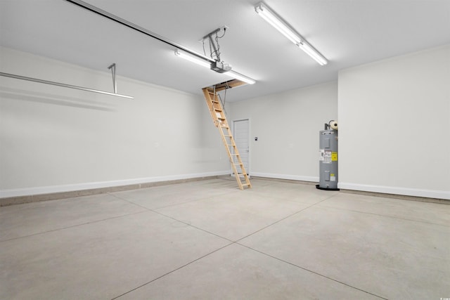 garage with a garage door opener and electric water heater