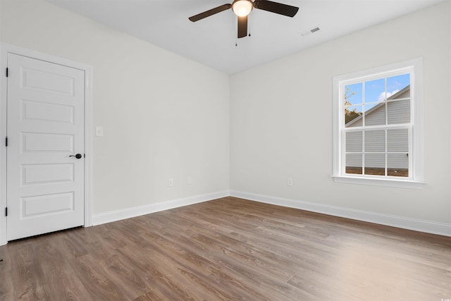 unfurnished room featuring wood-type flooring and ceiling fan