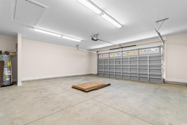 garage featuring a garage door opener and water heater