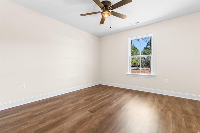 spare room featuring hardwood / wood-style floors and ceiling fan