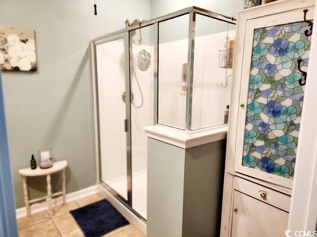 2256 Heritage Loop Unit 2256, Myrtle Beach, SC 29577 - bathroom featuring baseboards, a stall shower, and tile patterned flooring