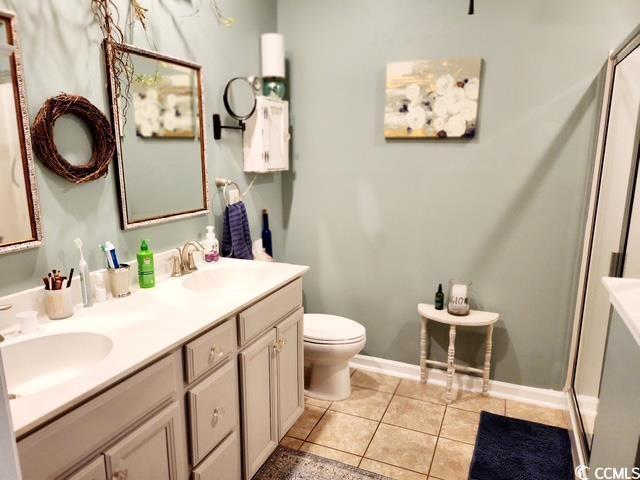 2256 Heritage Loop Unit 2256, Myrtle Beach, SC 29577 - full bath featuring toilet, tile patterned flooring, a sink, and double vanity