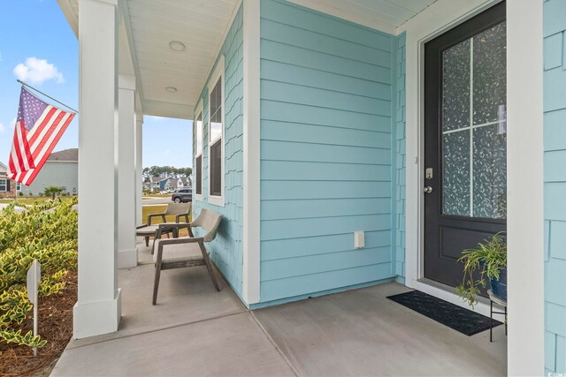 property entrance with covered porch