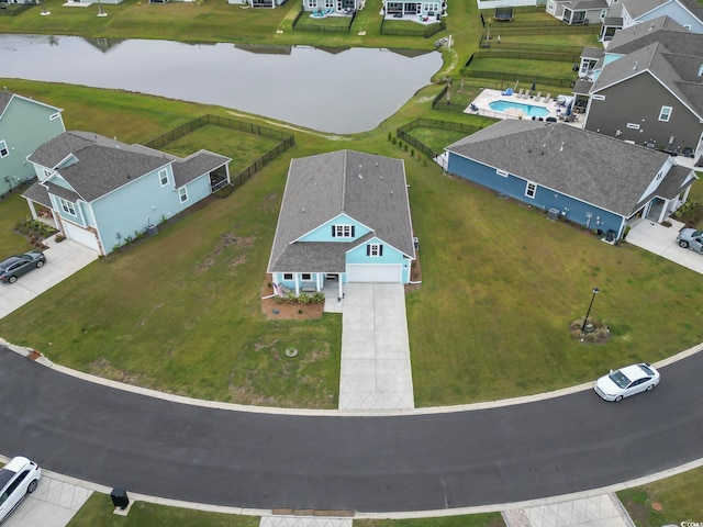 birds eye view of property with a water view