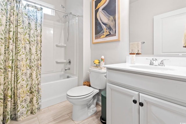 full bathroom featuring shower / bathtub combination with curtain, vanity, and toilet