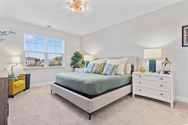 bedroom featuring light carpet