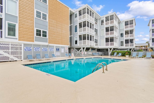 view of pool featuring a patio area