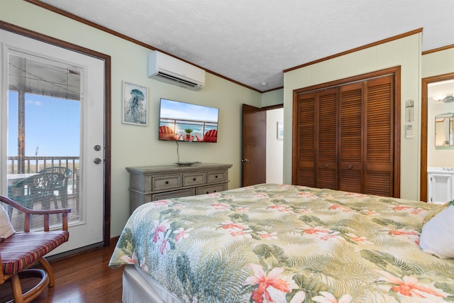 bedroom with crown molding, a textured ceiling, a wall mounted AC, dark hardwood / wood-style flooring, and a closet