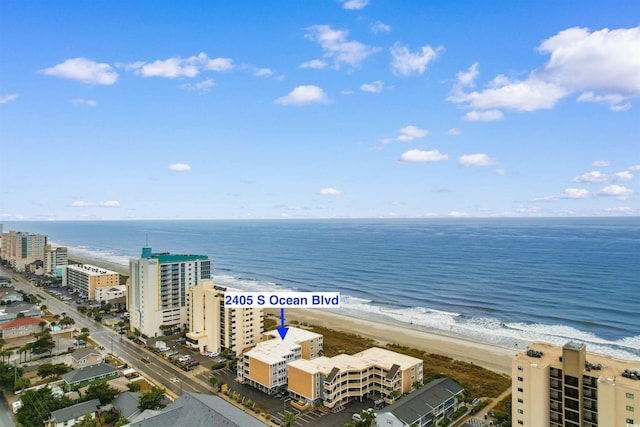 aerial view featuring a water view and a view of the beach