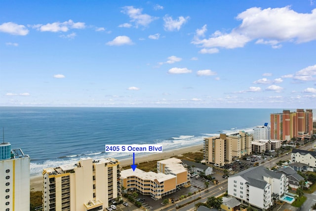 bird's eye view with a water view and a view of the beach