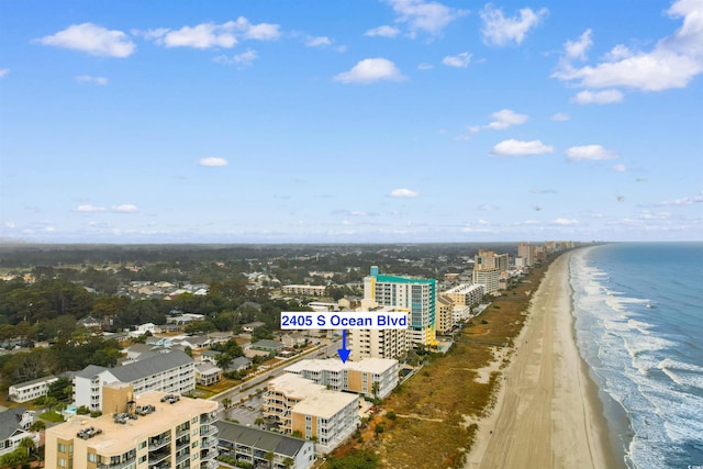 bird's eye view featuring a view of the beach and a water view