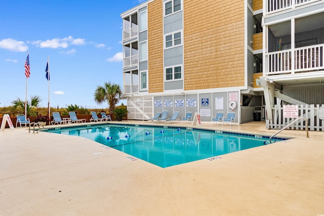 view of swimming pool featuring a patio area