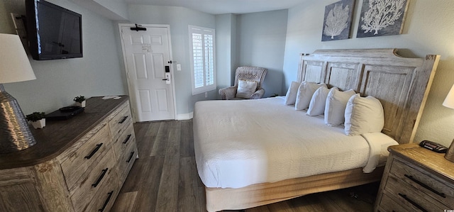 bedroom featuring dark hardwood / wood-style floors