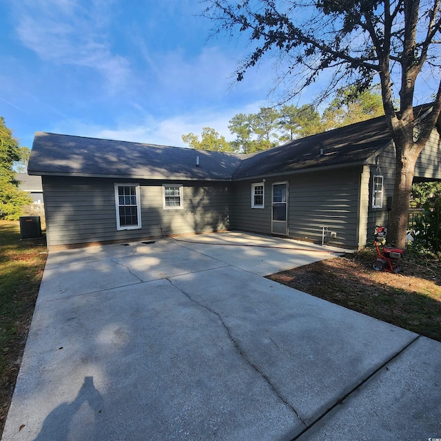 back of house featuring cooling unit and a patio