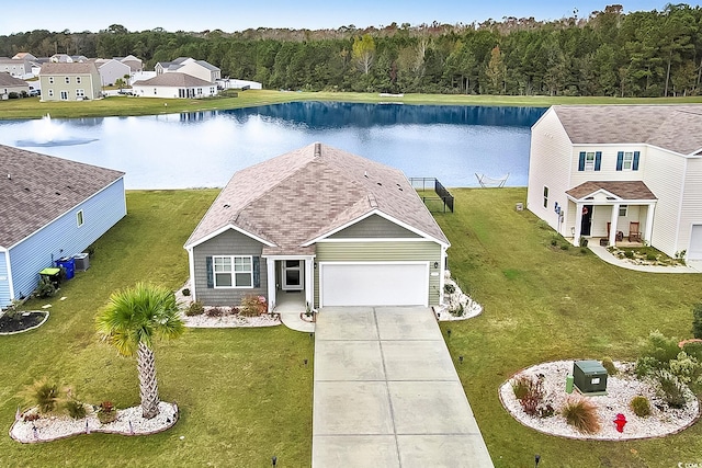 birds eye view of property with a water view