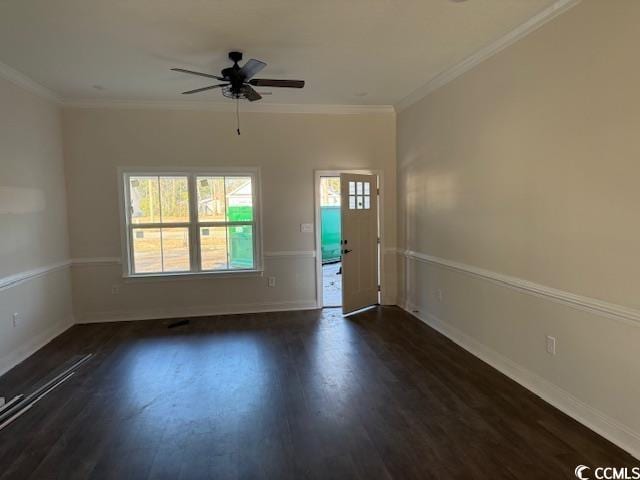 entryway with dark wood-type flooring, plenty of natural light, and crown molding