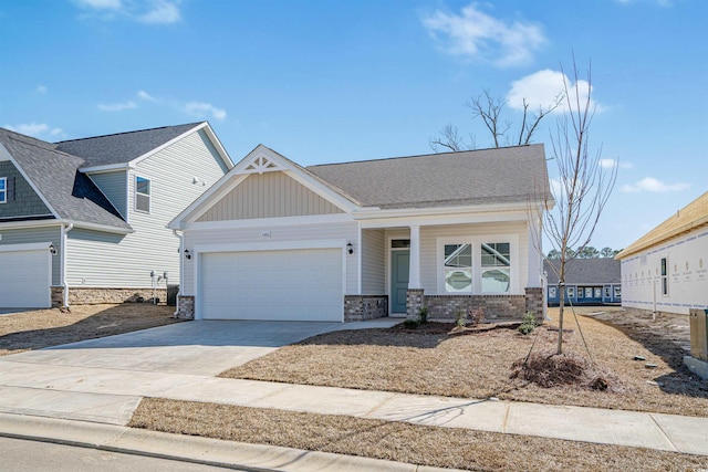 craftsman house featuring concrete driveway, board and batten siding, and an attached garage