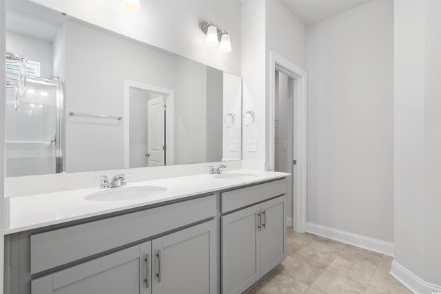 bathroom with vanity, wood-type flooring, and a shower with door