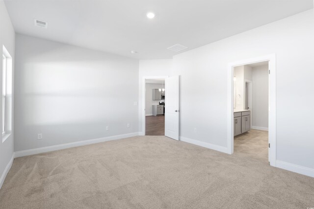 bathroom with hardwood / wood-style floors, vanity, toilet, and a shower with door