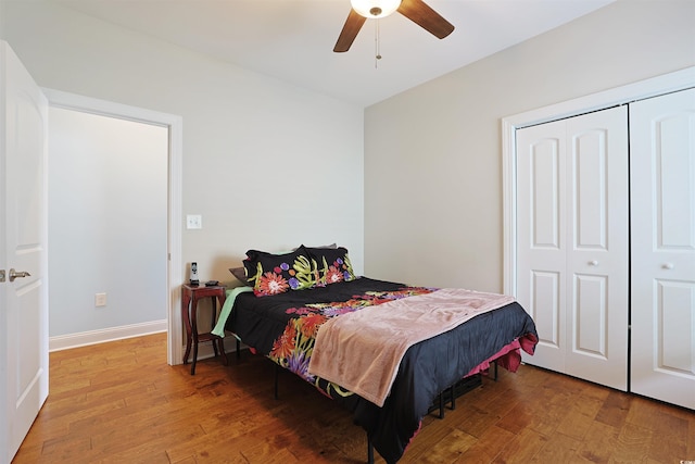 bedroom with a closet, ceiling fan, and hardwood / wood-style floors