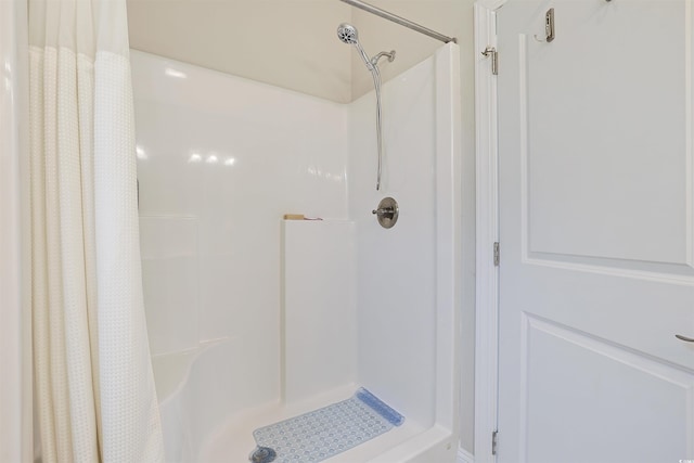 bathroom with a shower with shower curtain