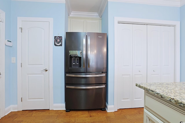 kitchen featuring stainless steel fridge with ice dispenser, light hardwood / wood-style flooring, light stone counters, and ornamental molding