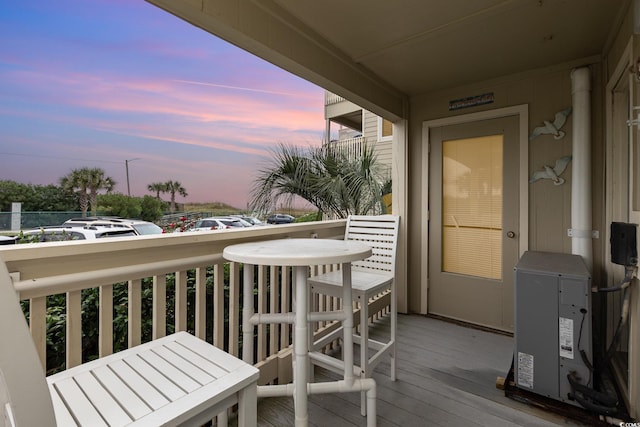 view of balcony at dusk