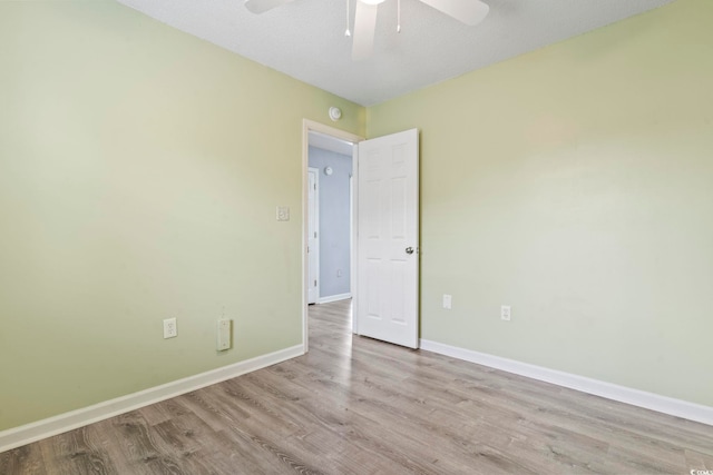 empty room featuring light hardwood / wood-style floors and ceiling fan