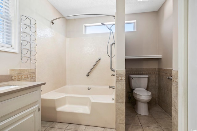 full bathroom with tile walls, a textured ceiling, bathtub / shower combination, tile patterned floors, and toilet