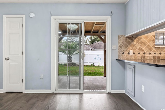 doorway featuring dark wood-type flooring