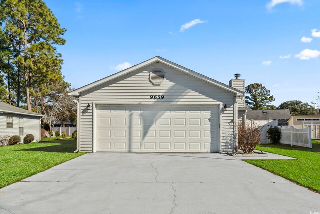 view of front facade with a front lawn and a garage