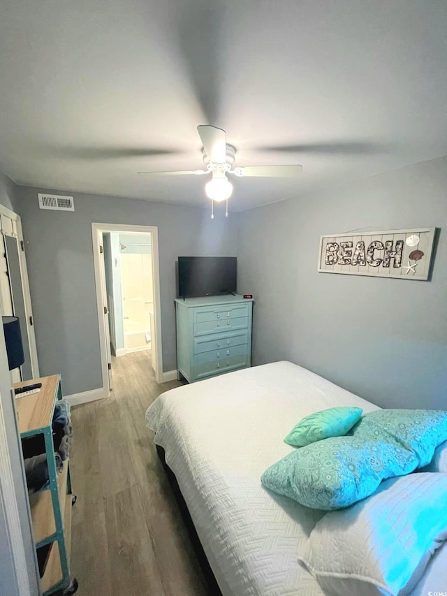 bedroom featuring hardwood / wood-style flooring and ceiling fan