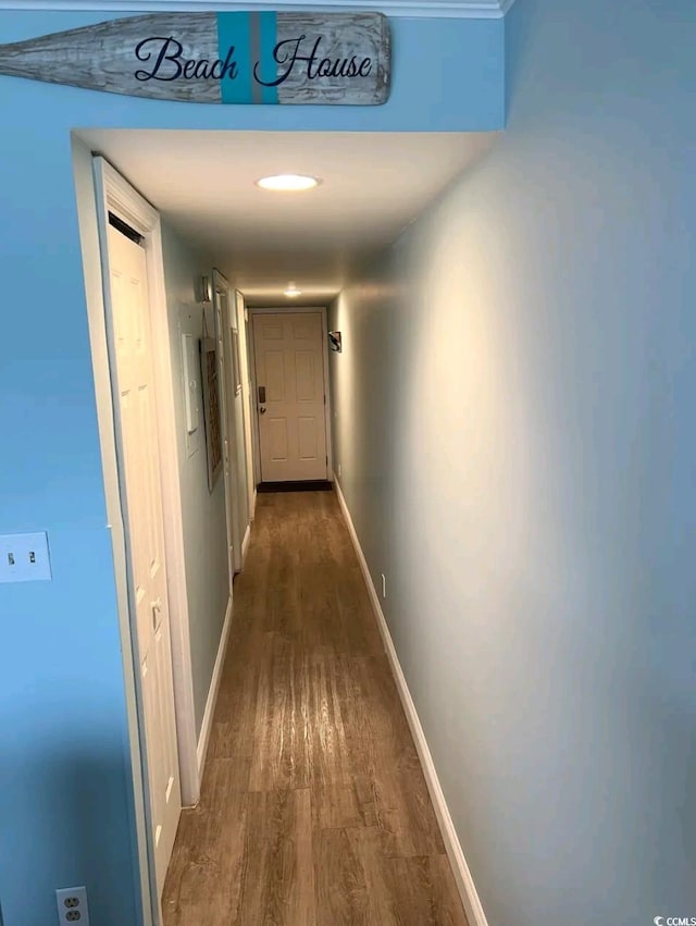 hallway with dark hardwood / wood-style floors