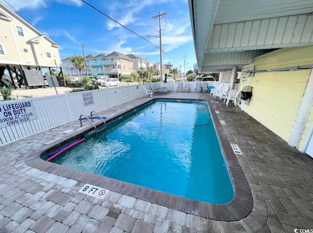 view of swimming pool featuring a patio