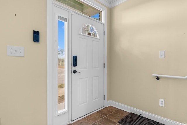 tiled foyer with crown molding