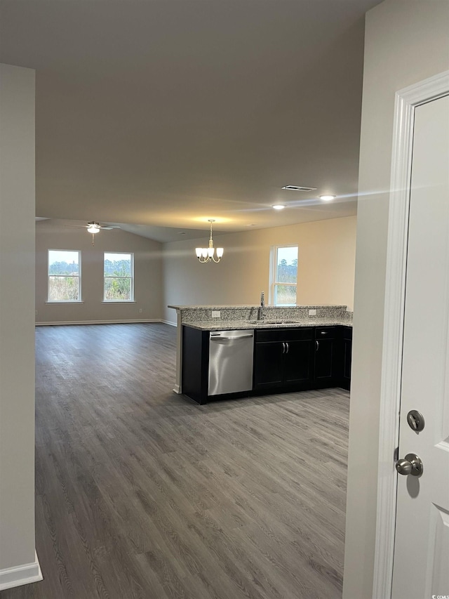 kitchen with ceiling fan with notable chandelier, sink, kitchen peninsula, stainless steel dishwasher, and wood-type flooring
