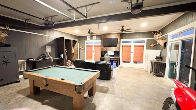 playroom featuring french doors, pool table, and concrete flooring