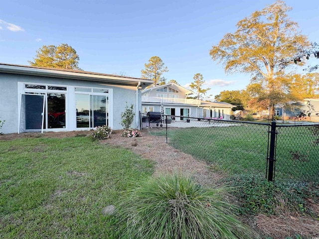 back of house with a yard