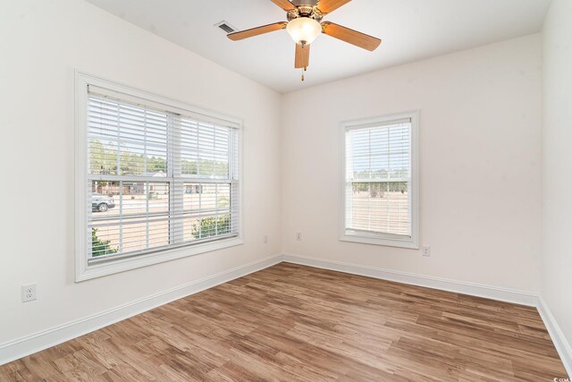 unfurnished room featuring light wood-type flooring and ceiling fan