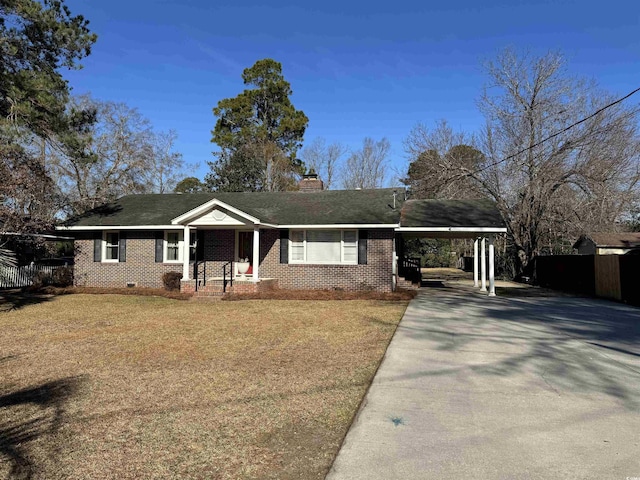 ranch-style house with a carport and a front lawn