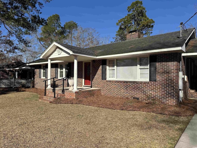 view of front of home with a porch and a front yard