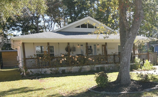 view of front of home with a porch and a front yard