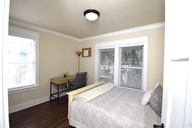 bedroom featuring crown molding, dark wood-type flooring, and multiple windows