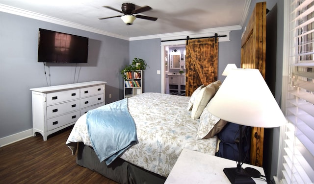 bedroom featuring ceiling fan, dark hardwood / wood-style floors, a barn door, ornamental molding, and connected bathroom