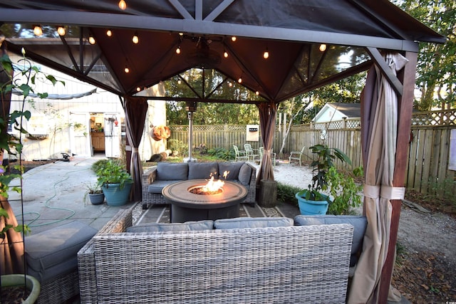 view of patio with a gazebo and a fire pit