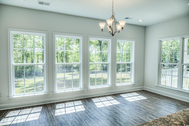 unfurnished sunroom with an inviting chandelier and plenty of natural light