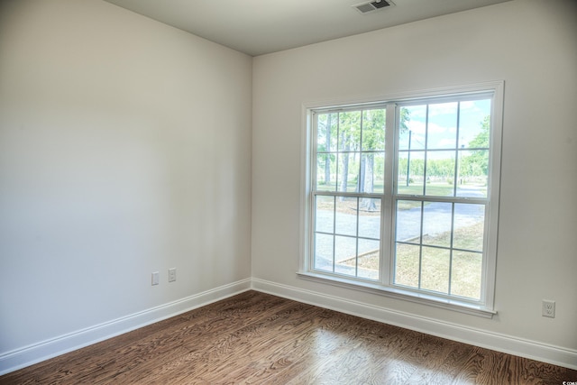 spare room featuring hardwood / wood-style floors